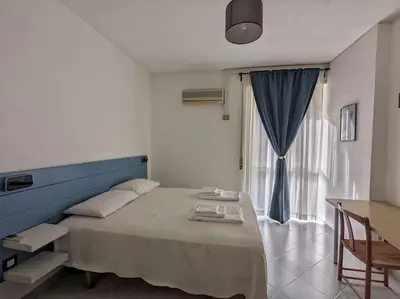 a bedroom with a large bed and a window at SyrakaHost Intero appartamento in Rome