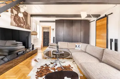 a living room with a couch and a table at Palazzo Centini Toni - Rome with style in Rome