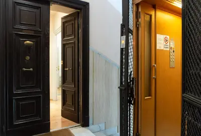 an open door leading to a hallway with a staircase at Residenza Ottaviani Roma in Rome