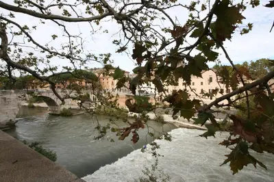 a river with a bridge in a city at Maison della Luce in Rome