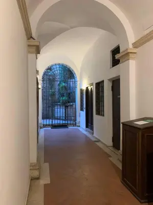 an empty hallway with a gate in a building at Navona Rhome in Rome