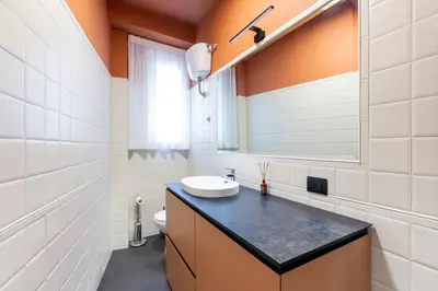 a bathroom with a sink and a mirror at LUCIANO LUXURY APARTMENT in Rome