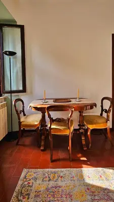 a bedroom with a large bed with pictures on the wall at Casa Verde in Rome