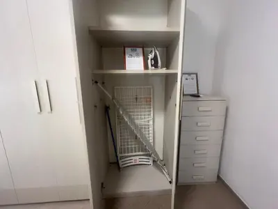 a closet with a ladder and a book shelf at Casa Gemelli in Rome