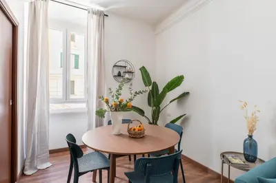a dining room with a table and chairs at iFlat Colosseum Charming Flat in Rome