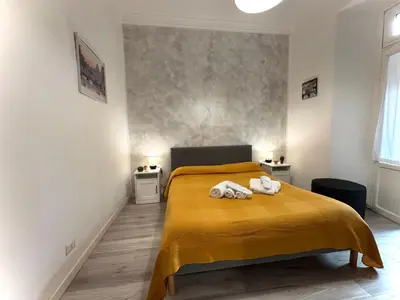 a bedroom with a bed with two towels on it at AmoR San Lorenzo in Rome