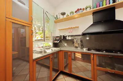 a kitchen with a sink and a stove at 3V Luxury Apartment by Hili in Rome