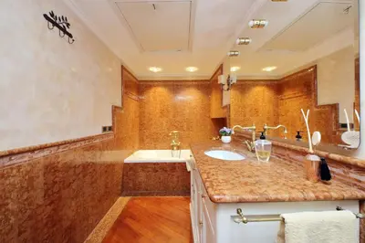 a bathroom with a sink and a large mirror at 3V Luxury Apartment by Hili in Rome