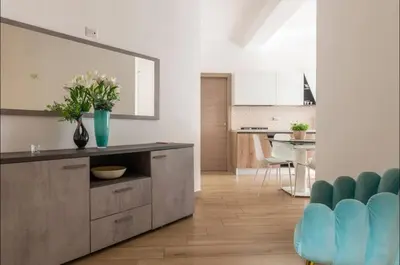 a kitchen with a counter with a vase of flowers on it at Large Garden in Rome