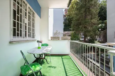 a small balcony with a table and chairs at Domus Ascanio by the Vatican in Rome