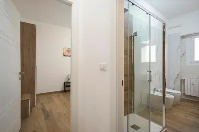 a bathroom with a glass shower and a toilet at Domus Ascanio by the Vatican in Rome