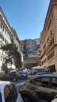 a city street filled with lots of cars and buildings at Sun's House in Rome