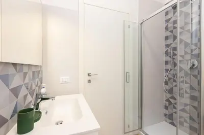a bathroom with a sink and a shower at Faleria by Rental in Rome in Rome