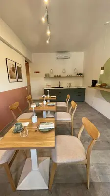 a dining room with a wooden table and chairs at 633 APPIA DESIGN ROOM in Rome
