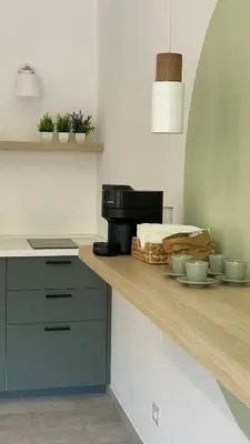 a kitchen with a counter with a coffee maker on it at 633 APPIA DESIGN ROOM in Rome