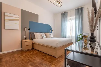 a bedroom with a bed and a glass table at YCH-Bright and cozy flat in Pigneto in Rome