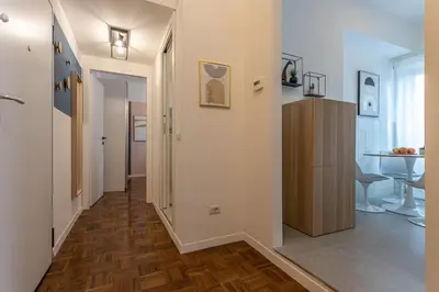 a hallway leading to a room with a table at YCH-Bright and cozy flat in Pigneto in Rome