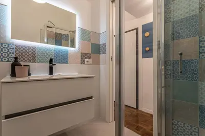 a bathroom with a sink and a shower at YCH-Bright and cozy flat in Pigneto in Rome