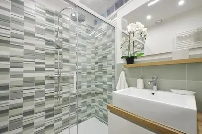 a bathroom with a sink and a shower at YCH-Grazioso Bilocale vicino al Vaticano in Rome