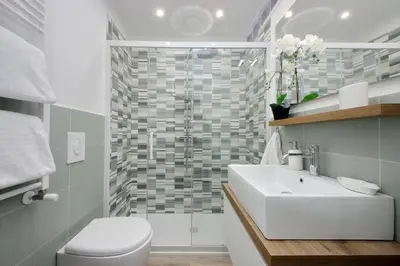 a bathroom with a toilet and a sink and a shower at YCH-Grazioso Bilocale vicino al Vaticano in Rome