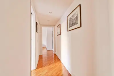 a hallway of a home with white walls and wood floors at Piazza Navona - Roma Centro Storico in Rome