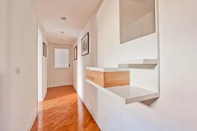 a hallway with white walls and white shelves at Piazza Navona - Roma Centro Storico in Rome