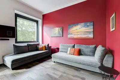 a living room with a couch and a window at Music Bridge Apartment in Rome