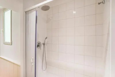 a bathroom with a shower with a glass door at Antica Dimora al Vaticano in Rome
