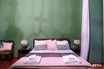 a bedroom with a bed with towels on it at Pantera Holiday House in Rome