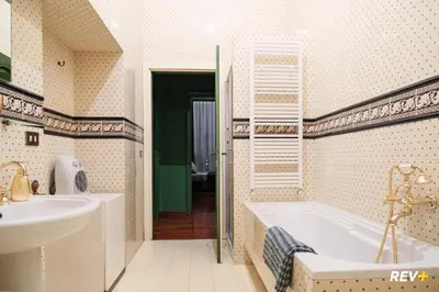 a bathroom with a tub and a sink at Pantera Holiday House in Rome