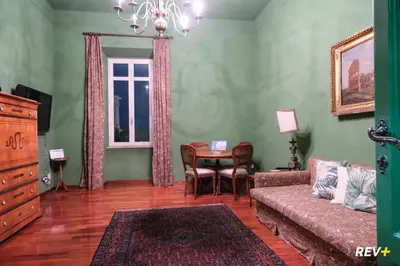 a living room with a couch and a table at Pantera Holiday House in Rome