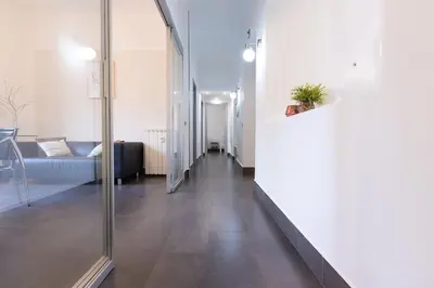 a hallway of a living room with a couch at MC Apartment San Giovanni in Rome