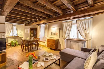a living room with a couch and a table at YourSuiteRome in Rome