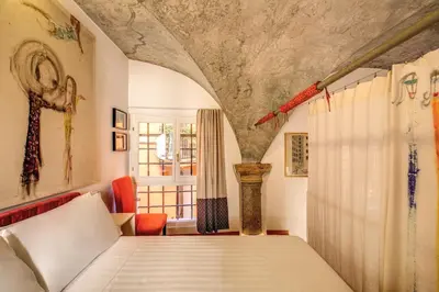 a bedroom with a bed and a window at YourSuiteRome in Rome