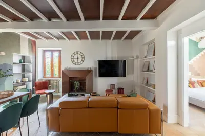 a living room with a couch and a tv at iFlat The Great Beauty in Rome