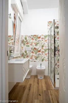 a bathroom with a tub and a toilet and a sink at Sophie's Choice in Rome