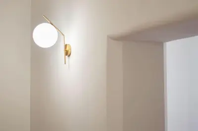 a white room with a door with a mirror at Appartamento di Charme San Giovanni - Colosseo in Rome
