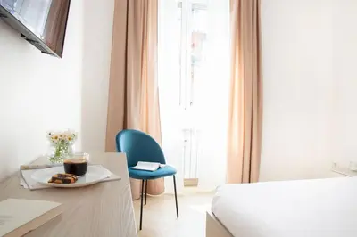 a room with a bed and a table with a plate of food at Esclusivo Appartamento di design (metro Tiburtina) in Rome