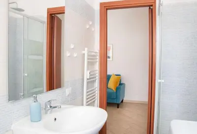 a bathroom with a sink and a mirror at Esclusivo Appartamento di design (metro Tiburtina) in Rome