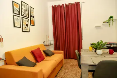 a living room with a couch and a table at MyWay RDR in Rome