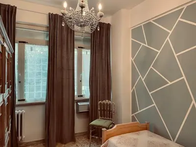 a bedroom with a bed and a chandelier at Rome Opéra Flat 2.0 in Rome