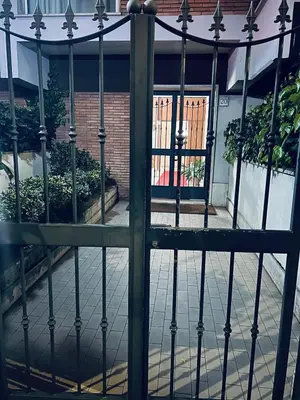 an iron gate in front of a building at Rome Opéra Flat 2.0 in Rome