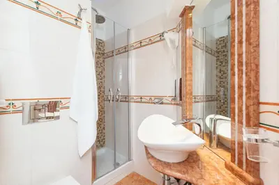 a bathroom with a sink and a shower at Impero Vaticano San Pietro in Rome