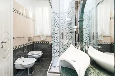 a bathroom with a sink and a toilet and a shower at Impero Vaticano San Pietro in Rome