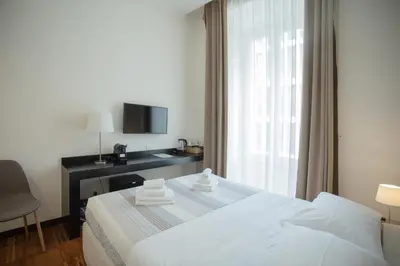 a hotel room with a bed and a window at OperaDreams2 in Rome