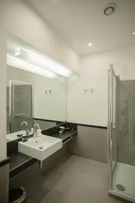 a bathroom with a sink and a shower at OperaDreams2 in Rome