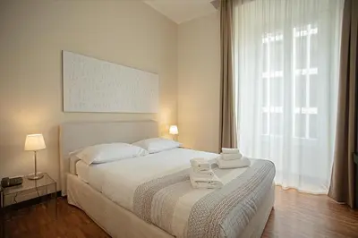 a bedroom with a bed with two towels on it at OperaDreams2 in Rome