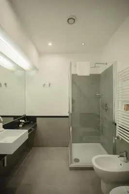 a bathroom with a shower and a toilet and a sink at OperaDreams2 in Rome