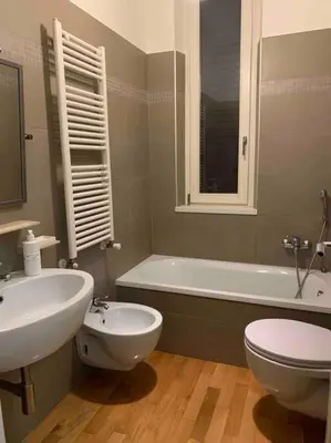 a bathroom with a sink and a toilet and a tub at In Città- appartamento a Roma con terrazzo in Rome