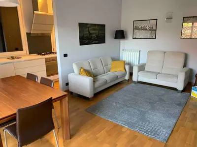 a living room with a couch and a table at In Città- appartamento a Roma con terrazzo in Rome